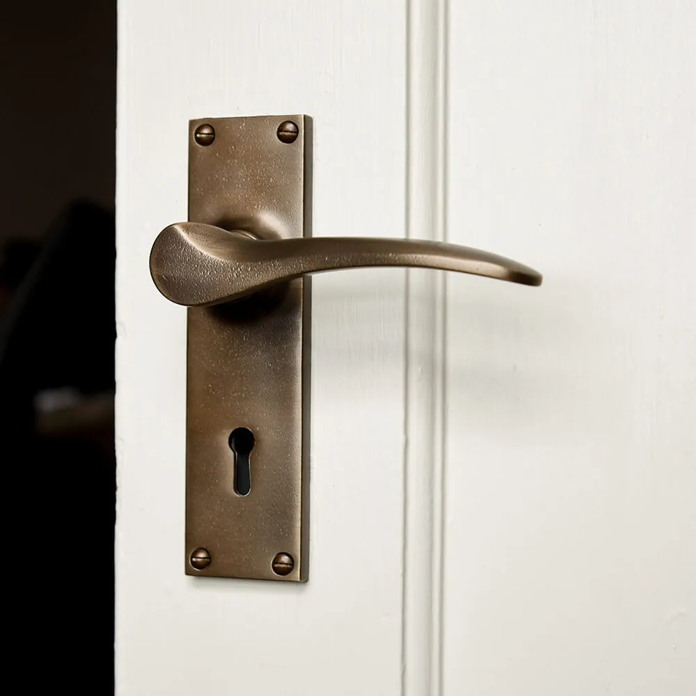 Distressed Antique Brass Penwerris Lever Lock Door Handles