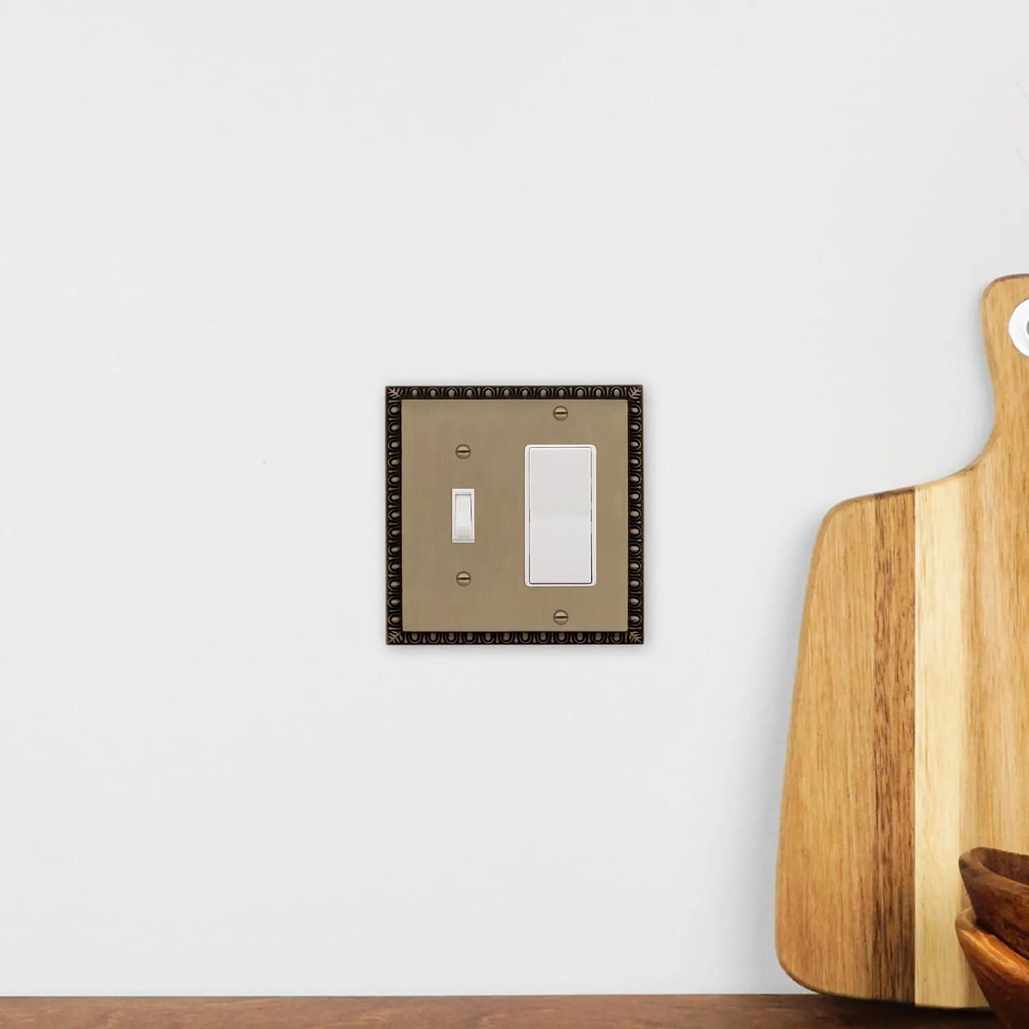 Egg & Dart Switch Plate with Toggle and Rocker in Antique Brass