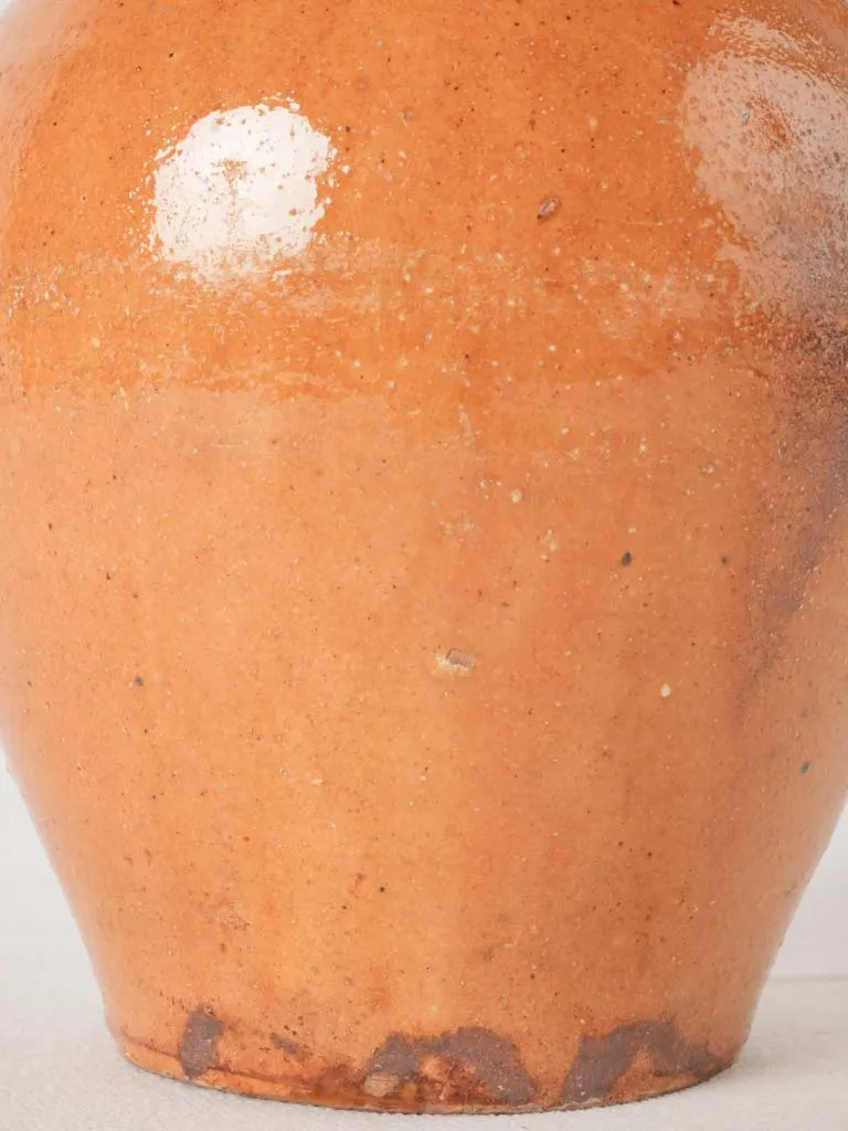 Ocher pitcher w/ ribbing at top 8"