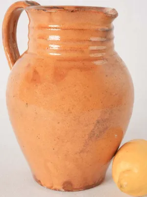 Ocher pitcher w/ ribbing at top 8"