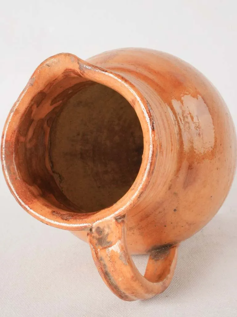 Ocher pitcher w/ ribbing at top 8"