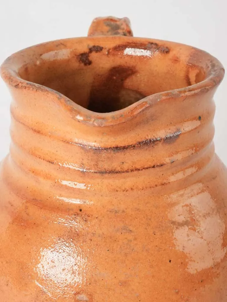 Ocher pitcher w/ ribbing at top 8"