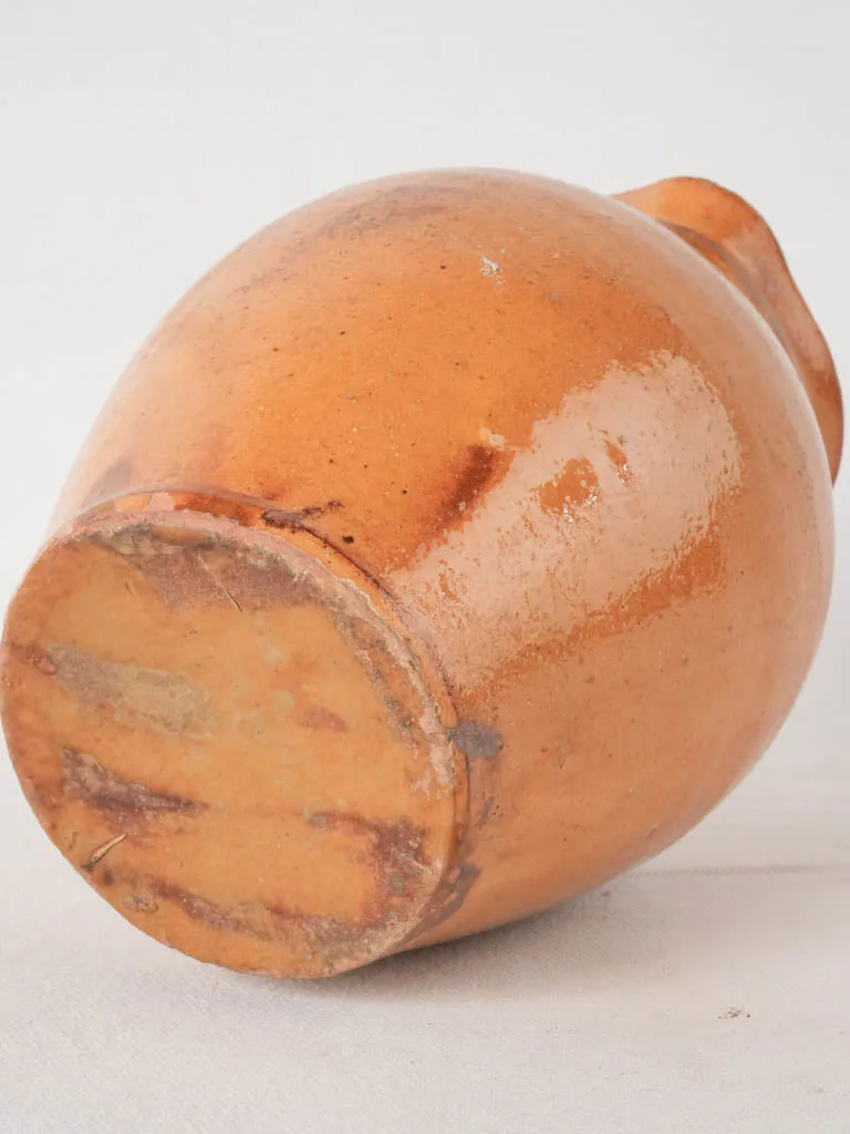 Ocher pitcher w/ ribbing at top 8"