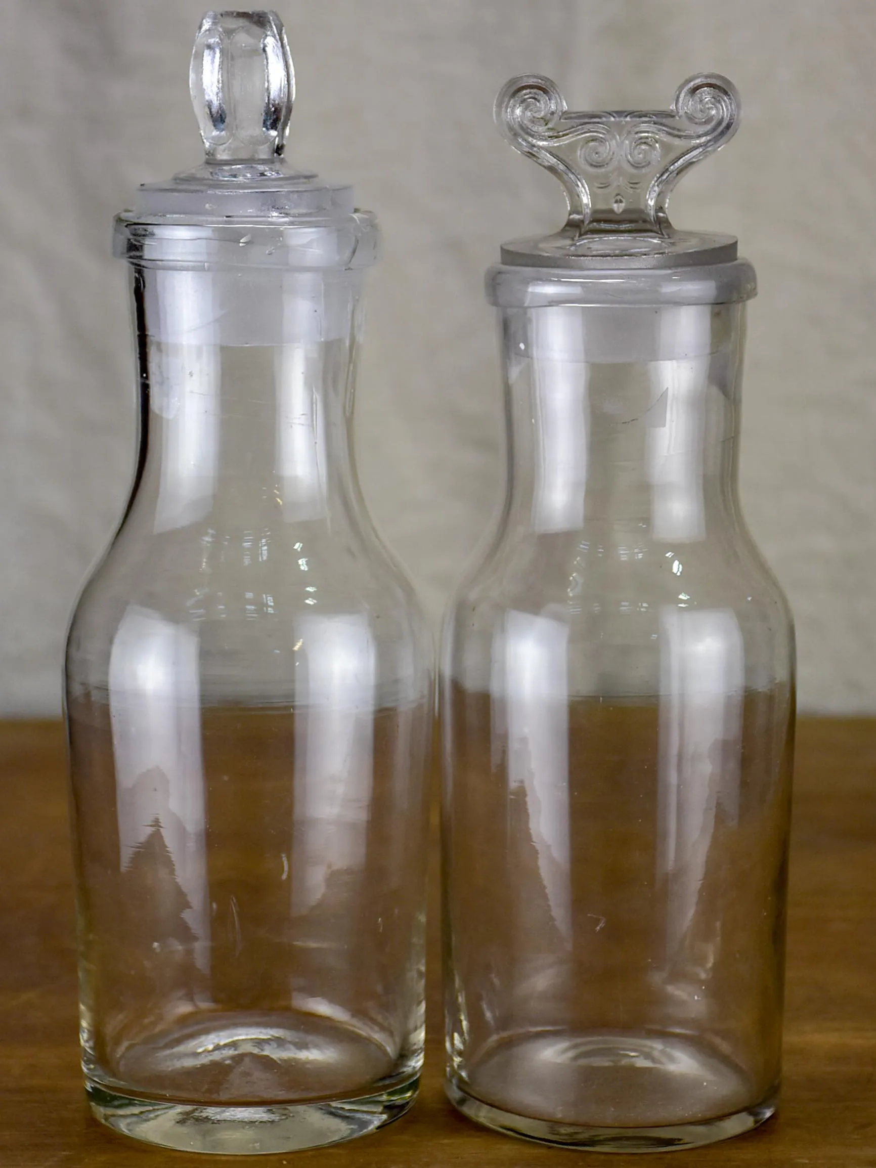 Two antique French glass apothecary bottles
