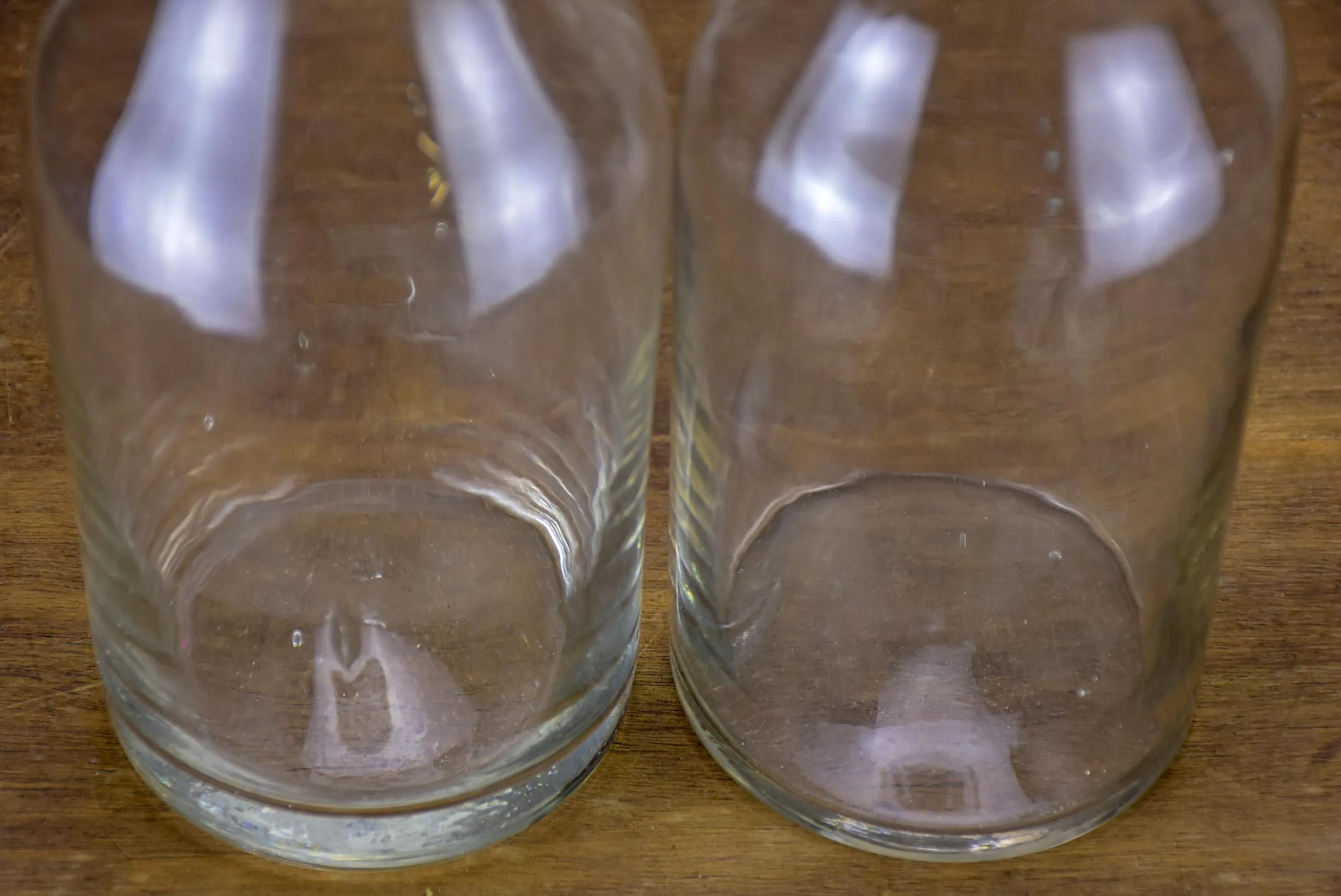 Two antique French glass apothecary bottles