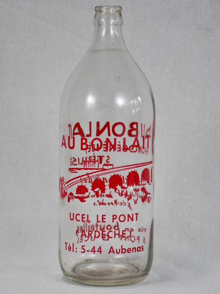 Vintage French consignment milk bottle with red label